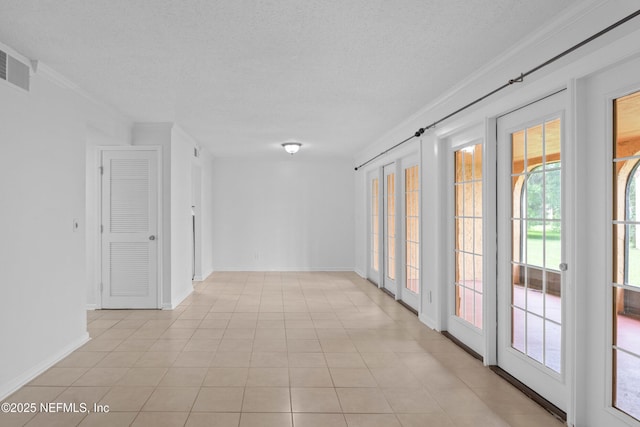6552 La Mirada Dr E Unit 7, Jacksonville, FL 32217 - corridor with crown molding, a textured ceiling, and baseboards