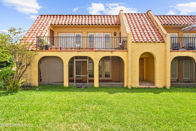 6552 La Mirada Dr E Unit 7, Jacksonville, FL 32217 - rear view of house with a balcony, a tile roof, and stucco siding