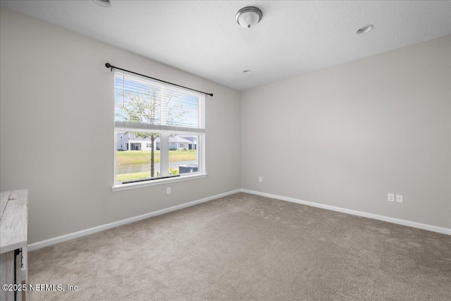 698 Cherry Elm Dr, Saint Augustine, FL 32092 - carpeted spare room featuring baseboards