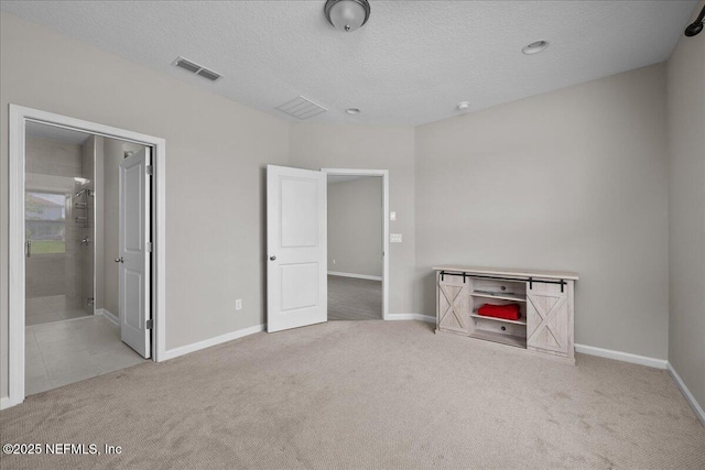 698 Cherry Elm Dr, Saint Augustine, FL 32092 - unfurnished bedroom featuring carpet floors, a textured ceiling, and baseboards