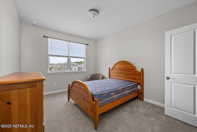 698 Cherry Elm Dr, Saint Augustine, FL 32092 - bedroom featuring light colored carpet, baseboards, and a textured ceiling