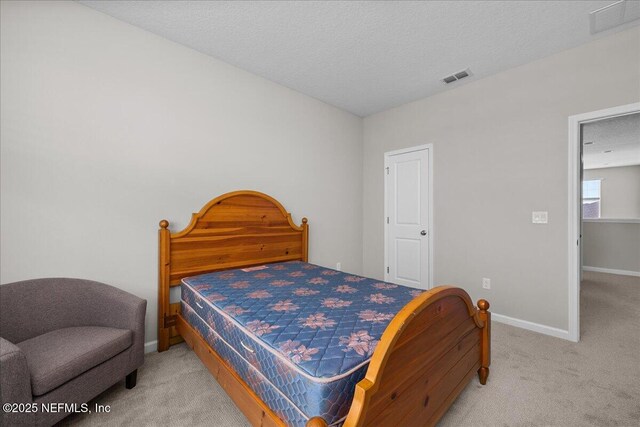 698 Cherry Elm Dr, Saint Augustine, FL 32092 - carpeted bedroom with baseboards and a textured ceiling