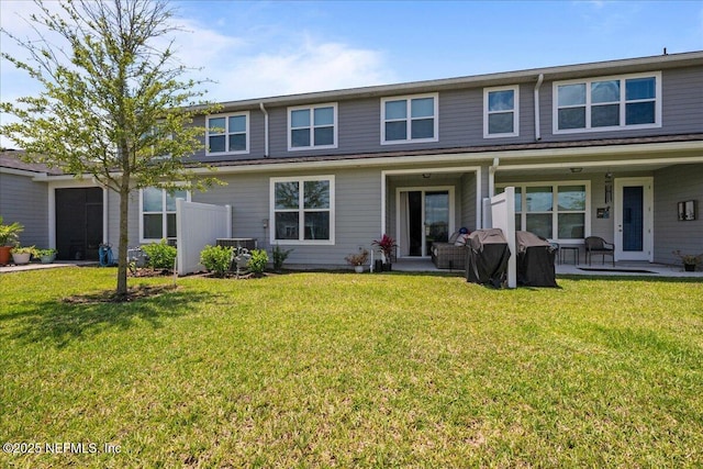 698 Cherry Elm Dr, Saint Augustine, FL 32092 - view of front of house with central air condition unit, a front lawn, and covered porch