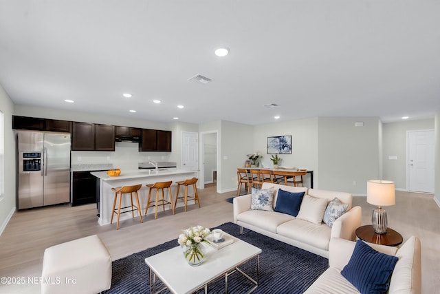 5420 Arlington Rd, Jacksonville, FL 32211 - living area featuring baseboards, recessed lighting, and light wood-type flooring