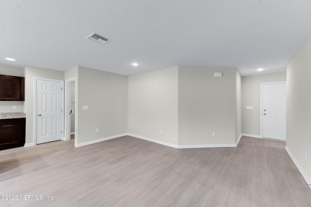 5420 Arlington Rd, Jacksonville, FL 32211 - unfurnished living room featuring light wood finished floors, recessed lighting, and baseboards