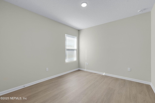 5420 Arlington Rd, Jacksonville, FL 32211 - spare room featuring light wood-style flooring, baseboards, and a smoke detector