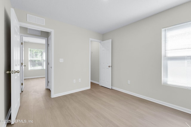 5420 Arlington Rd, Jacksonville, FL 32211 - unfurnished bedroom with light wood-type flooring and baseboards