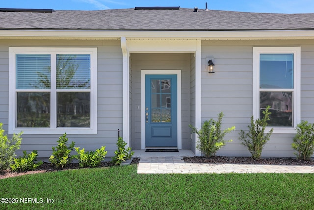 478 Cherry Elm Dr, Saint Augustine, FL 32092 - doorway to property with a lawn and a shingled roof