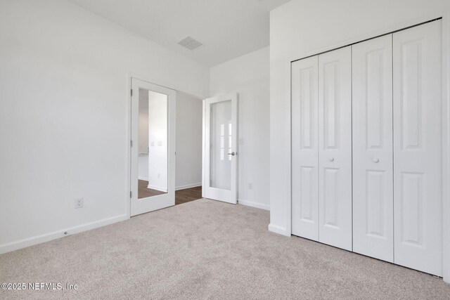 478 Cherry Elm Dr, Saint Augustine, FL 32092 - unfurnished bedroom with carpet, baseboards, and a closet