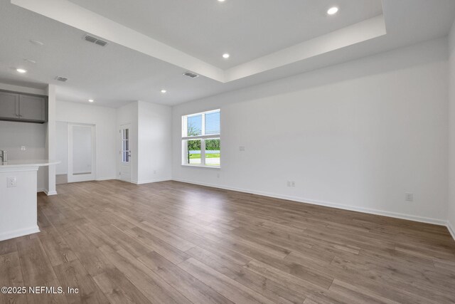 478 Cherry Elm Dr, Saint Augustine, FL 32092 - unfurnished living room featuring wood finished floors, recessed lighting, and baseboards