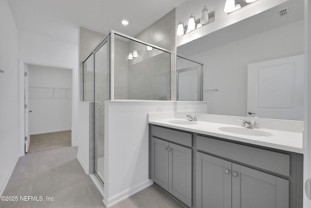 478 Cherry Elm Dr, Saint Augustine, FL 32092 - full bath featuring a shower stall, a walk in closet, double vanity, tile patterned floors, and recessed lighting