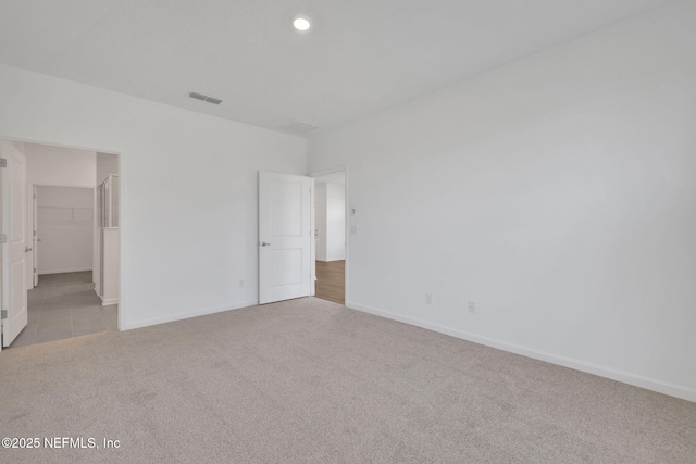 478 Cherry Elm Dr, Saint Augustine, FL 32092 - unfurnished bedroom with carpet floors, baseboards, a walk in closet, and recessed lighting