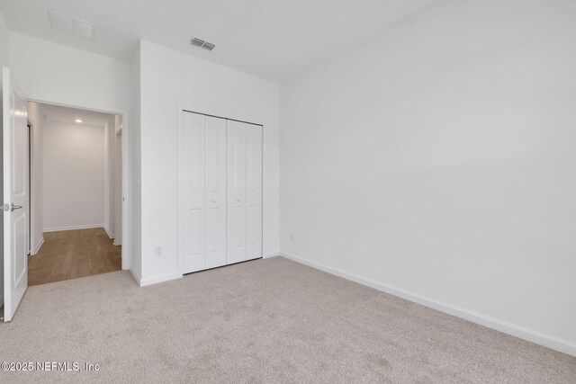 478 Cherry Elm Dr, Saint Augustine, FL 32092 - unfurnished bedroom featuring carpet, a closet, and baseboards