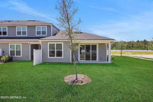 478 Cherry Elm Dr, Saint Augustine, FL 32092 - back of house with a yard and a shingled roof