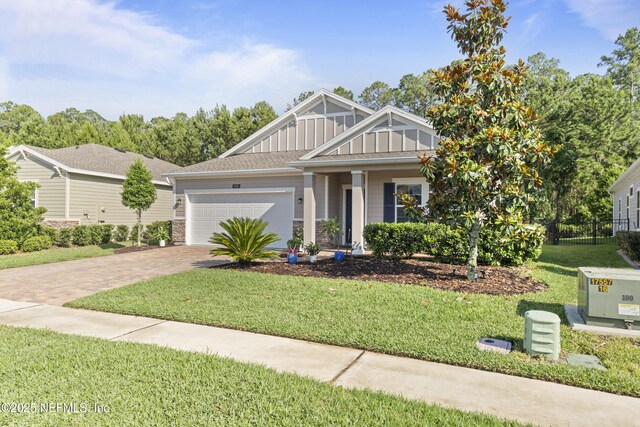 383 Saint Vincent Dr, Saint Augustine, FL 32092 - view of front facade featuring driveway, board and batten siding, and an attached garage