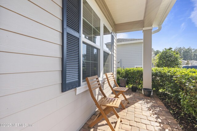 383 Saint Vincent Dr, Saint Augustine, FL 32092 - view of patio / terrace with covered porch