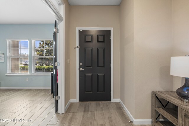 383 Saint Vincent Dr, Saint Augustine, FL 32092 - entryway featuring light wood-type flooring and baseboards