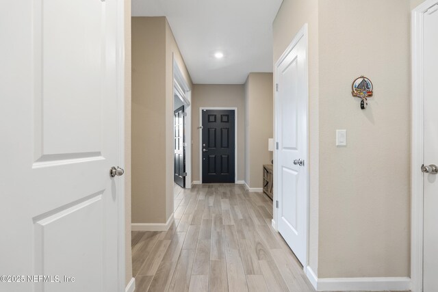 383 Saint Vincent Dr, Saint Augustine, FL 32092 - hallway with light wood-style flooring and baseboards