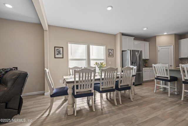 383 Saint Vincent Dr, Saint Augustine, FL 32092 - dining area with light wood-style flooring, recessed lighting, baseboards, and beam ceiling