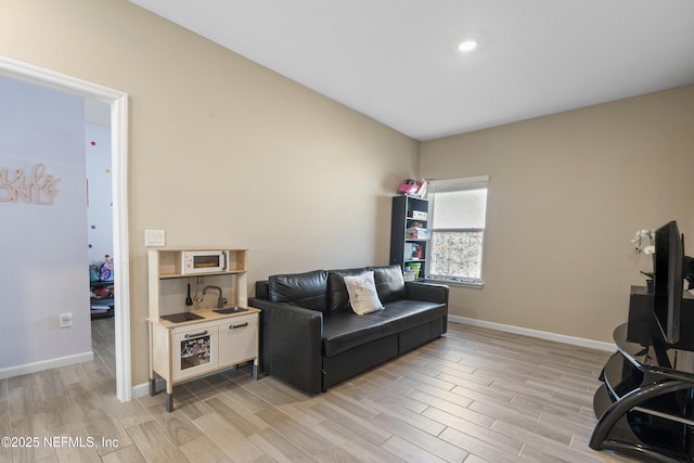383 Saint Vincent Dr, Saint Augustine, FL 32092 - living room with light wood-type flooring, baseboards, and recessed lighting