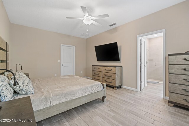 383 Saint Vincent Dr, Saint Augustine, FL 32092 - bedroom featuring wood finish floors, baseboards, ceiling fan, and ensuite bath
