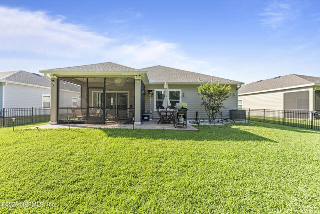 383 Saint Vincent Dr, Saint Augustine, FL 32092 - back of house with a sunroom, a patio, central AC, and roof with shingles