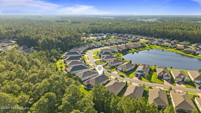 383 Saint Vincent Dr, Saint Augustine, FL 32092 - aerial overview of property's location featuring a heavily wooded area, nearby suburban area, and a large body of water