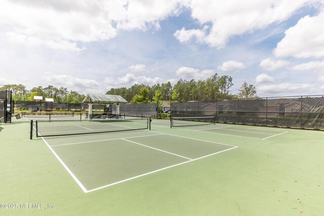 383 Saint Vincent Dr, Saint Augustine, FL 32092 - view of tennis court featuring fence and community basketball court