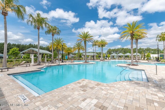 383 Saint Vincent Dr, Saint Augustine, FL 32092 - community pool featuring a patio area