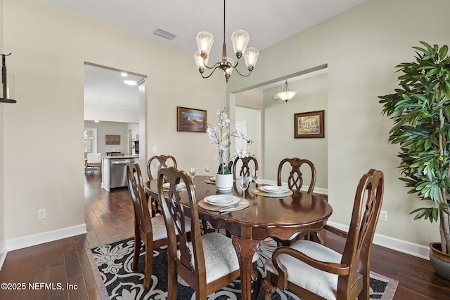 14048 Prater Ct, Jacksonville, FL 32224 - dining area featuring wood-type flooring, a chandelier, and baseboards