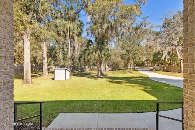 97002 Jose Gaspar Way, Yulee, FL 32097 - view of yard with an outdoor structure and a storage shed