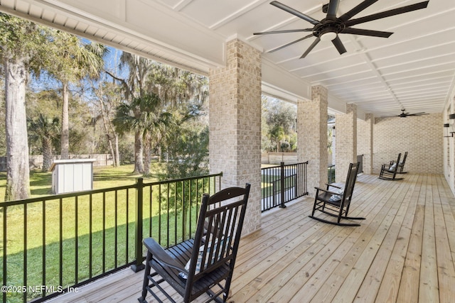 97002 Jose Gaspar Way, Yulee, FL 32097 - deck featuring a ceiling fan and a yard