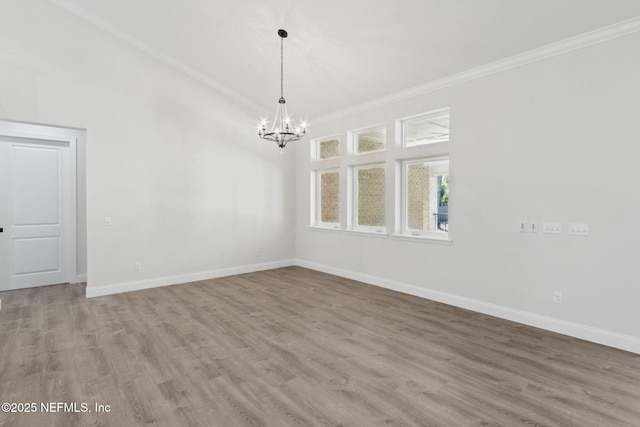 97002 Jose Gaspar Way, Yulee, FL 32097 - empty room featuring ornamental molding, a chandelier, wood finished floors, and baseboards