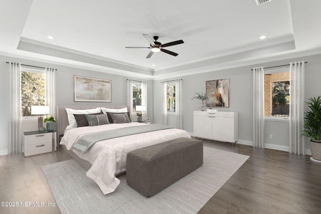 97002 Jose Gaspar Way, Yulee, FL 32097 - bedroom with a tray ceiling, multiple windows, wood finished floors, ornamental molding, and recessed lighting