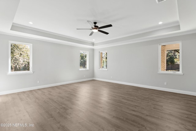 97002 Jose Gaspar Way, Yulee, FL 32097 - spare room with a tray ceiling, crown molding, a ceiling fan, wood finished floors, and baseboards