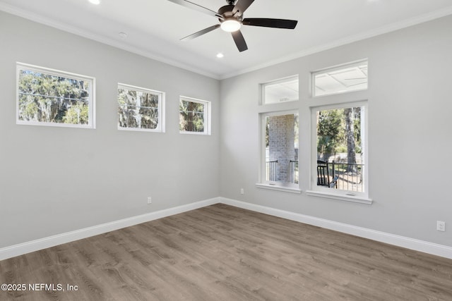 97002 Jose Gaspar Way, Yulee, FL 32097 - spare room featuring ornamental molding, a ceiling fan, recessed lighting, baseboards, and wood finished floors