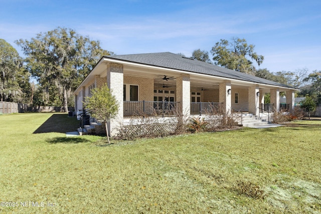 97002 Jose Gaspar Way, Yulee, FL 32097 - view of front facade with ceiling fan, brick siding, and covered porch