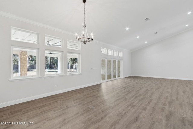 97002 Jose Gaspar Way, Yulee, FL 32097 - unfurnished living room featuring crown molding, a chandelier, wood finished floors, baseboards, and recessed lighting