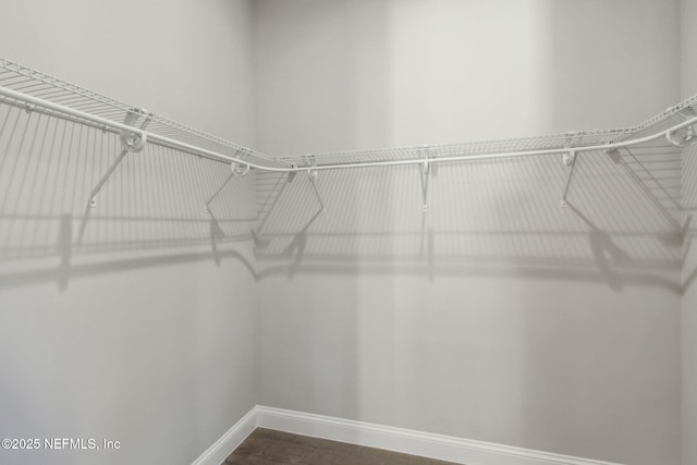 97002 Jose Gaspar Way, Yulee, FL 32097 - walk in closet featuring dark wood finished floors