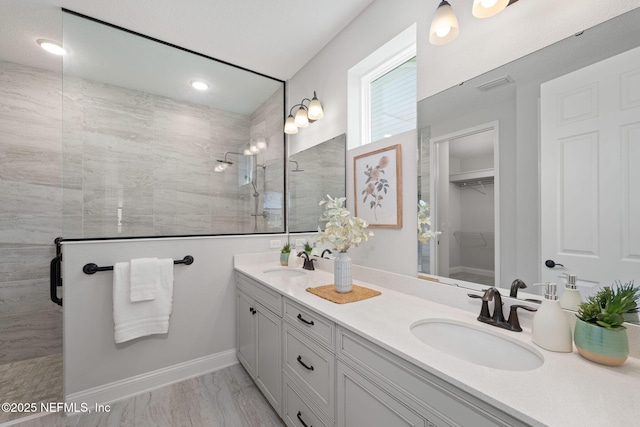 275 Kellet Way, Saint Johns, FL 32259 - full bathroom with double vanity, walk in shower, a walk in closet, baseboards, and recessed lighting