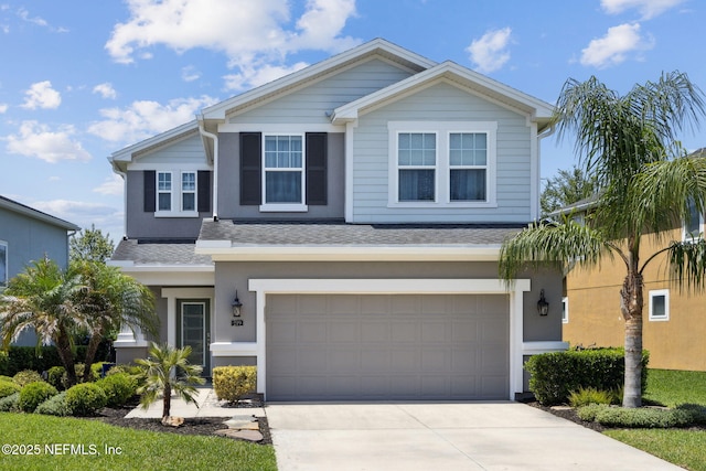 219 Heron Landing Rd, Saint Johns, FL 32259 - traditional-style house with an attached garage, a shingled roof, driveway, and stucco siding