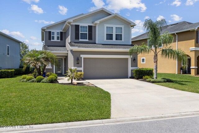 219 Heron Landing Rd, Saint Johns, FL 32259 - view of front of home with an attached garage, driveway, a front yard, stucco siding, and roof with shingles
