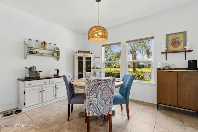 219 Heron Landing Rd, Saint Johns, FL 32259 - dining area with light tile patterned floors and baseboards