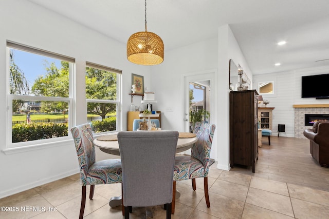 219 Heron Landing Rd, Saint Johns, FL 32259 - dining room featuring healthy amount of natural light, a tile fireplace, baseboards, light tile patterned floors, and recessed lighting
