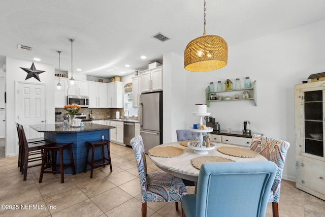 219 Heron Landing Rd, Saint Johns, FL 32259 - dining space with recessed lighting and light tile patterned floors