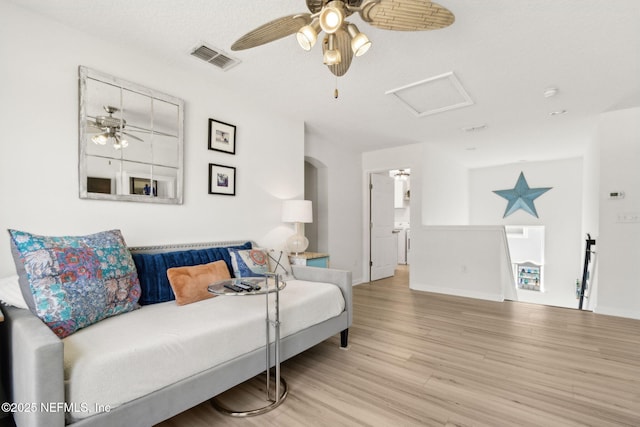 219 Heron Landing Rd, Saint Johns, FL 32259 - living room featuring a ceiling fan, wood finished floors, attic access, and baseboards