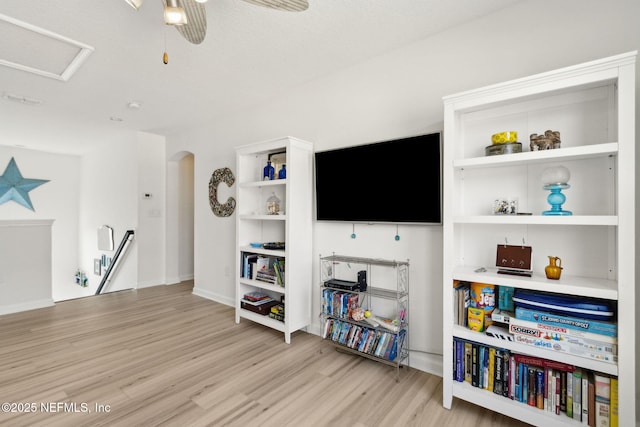 219 Heron Landing Rd, Saint Johns, FL 32259 - living area with light wood-style flooring, a ceiling fan, arched walkways, and baseboards