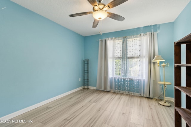 219 Heron Landing Rd, Saint Johns, FL 32259 - unfurnished room featuring wood finished floors, ceiling fan, and baseboards
