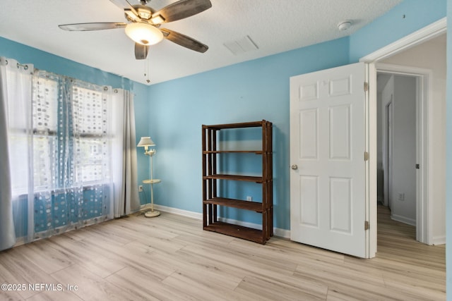 219 Heron Landing Rd, Saint Johns, FL 32259 - spare room with a ceiling fan, light wood finished floors, baseboards, a smoke detector, and a textured ceiling