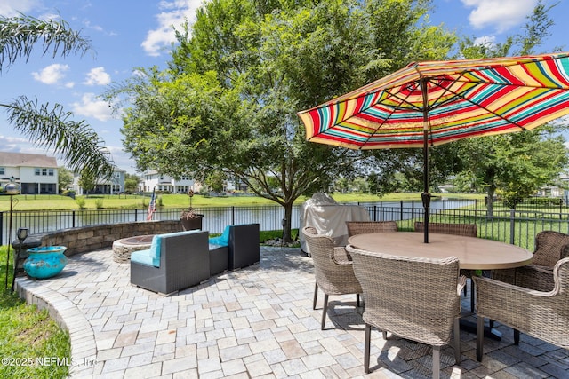 219 Heron Landing Rd, Saint Johns, FL 32259 - fenced backyard featuring a patio area, outdoor dining area, and a water view